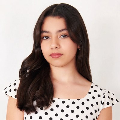 Young Latina girl in polka dot dress
