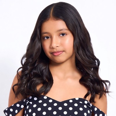 Girl in polka dot dress smiling