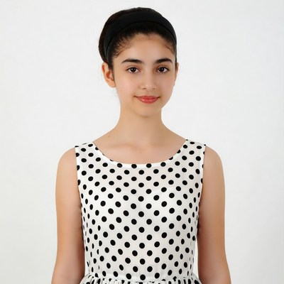 Girl in polka dot dress smiling