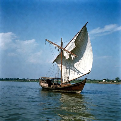 Traditional Wooden Dhow Sailing River
