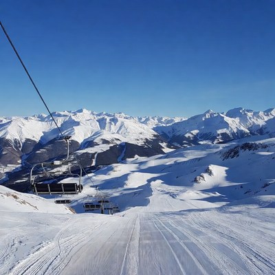 Ski Lift Over Snowy Mountains