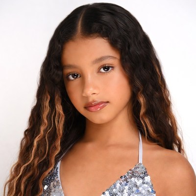 Young Black girl in sequin top