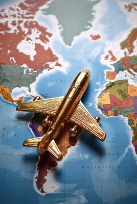 Golden airplane on world map
