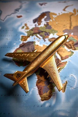 Golden airplane on world map