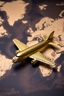 Golden Airplane on World Map