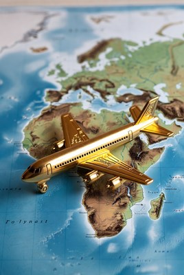 Golden Airplane on World Map