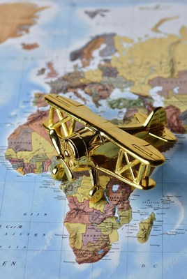 Golden Airplane Model on World Map