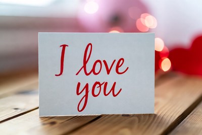 I Love You card on wooden table