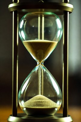 Sand flowing in hourglass