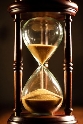 Sand flowing in hourglass