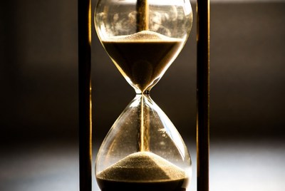 Sand flowing in hourglass