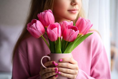 Woman holding pink tulips