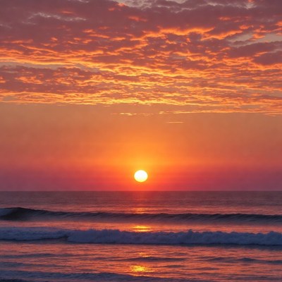 Sunset over ocean waves