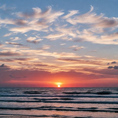 Sunset over ocean waves