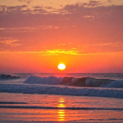 Sunset over ocean waves