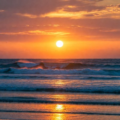 Sunset over ocean waves