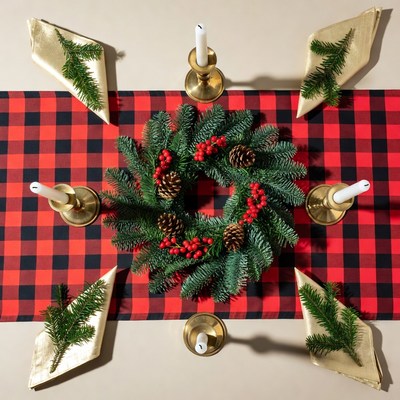 Christmas wreath on plaid tablecloth