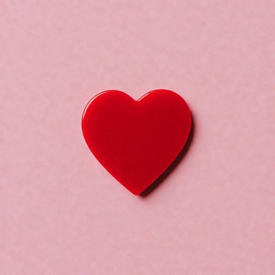 Red heart on pink background