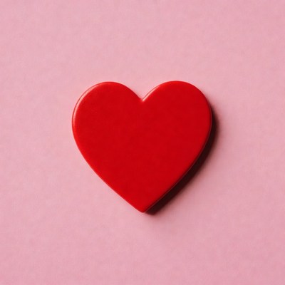 Red heart on pink background