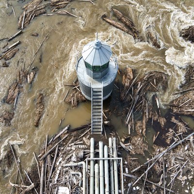 Lighthouse amid Flood Debris