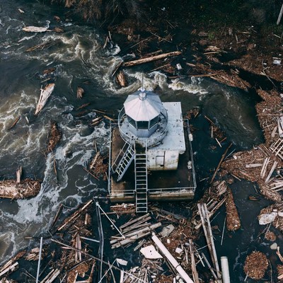 Lighthouse amid river debris
