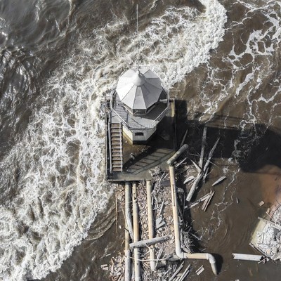 Aerial View of Lighthouse in Rough Ocean Waves