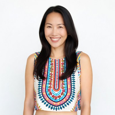 Asian woman smiling in colorful top