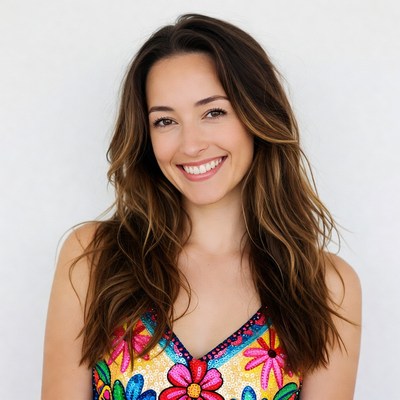 Smiling woman in colorful floral dress
