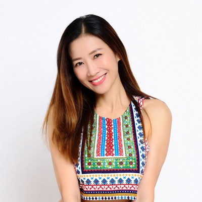 Asian woman smiling in colorful top