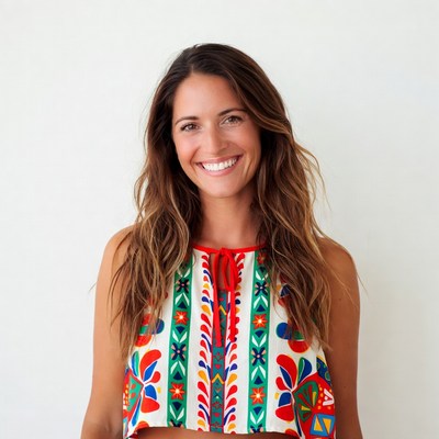 Smiling woman in colorful embroidered top