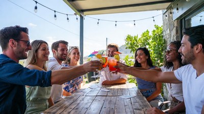 Group toasting drinks outdoors