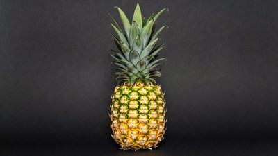 Pineapple on black background