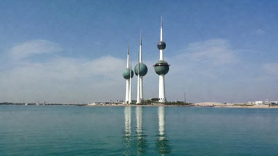 Kuwait Towers reflecting in water