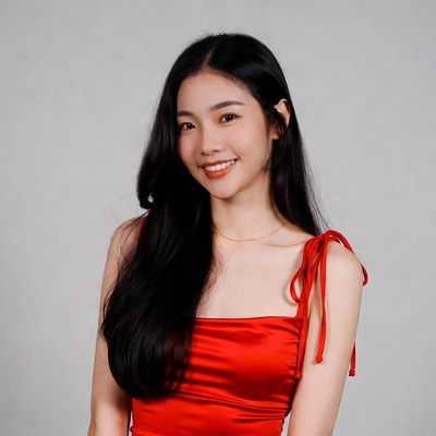 Asian woman in red dress smiling