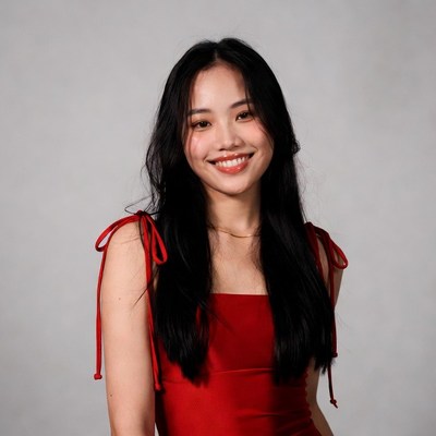 Asian woman in red dress smiling