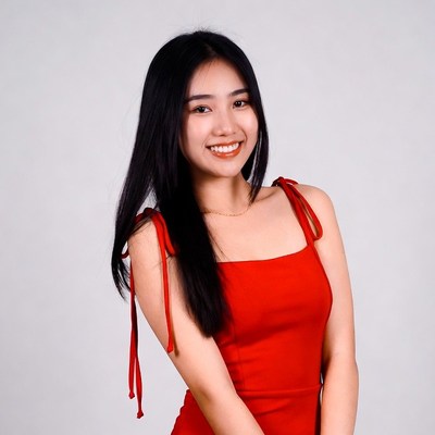 Asian woman in red dress smiling