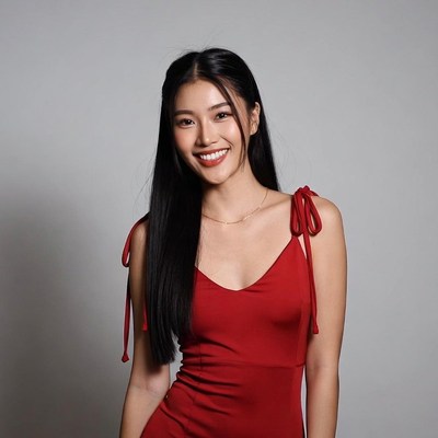 Asian woman in red dress smiling