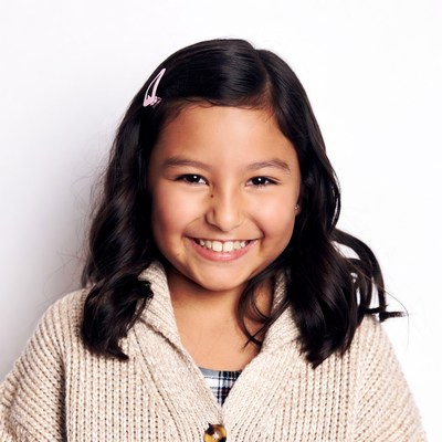 Smiling Asian girl with pink hair clip