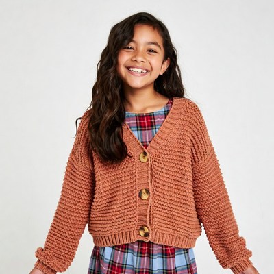 Smiling Asian girl in rust cardigan
