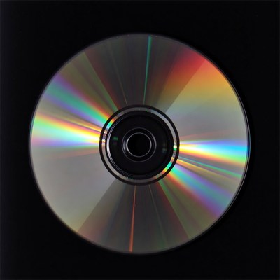 Shiny CD Disc on Black Background