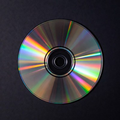 Shiny CD Disc on Black Background