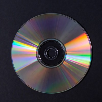Shiny CD Disc on Black Background