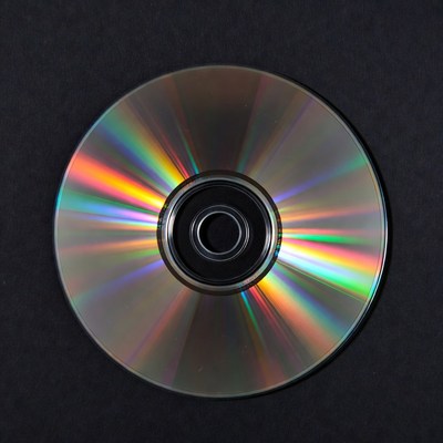Shiny CD Disc on Black Background