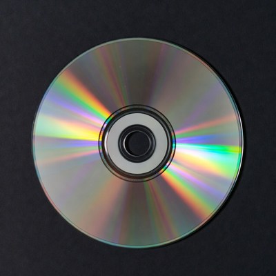 Shiny CD Disc on Black Background