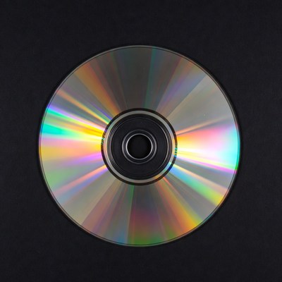 Shiny CD Disc on Black Background