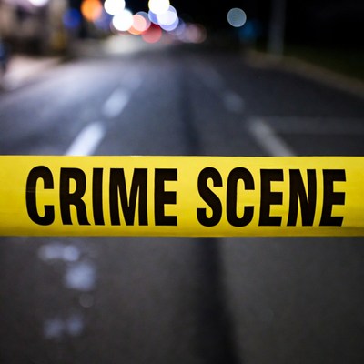 Crime Scene Tape on Night Road