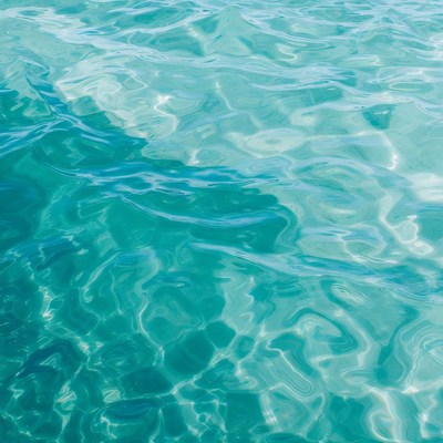 Clear turquoise ocean water waves