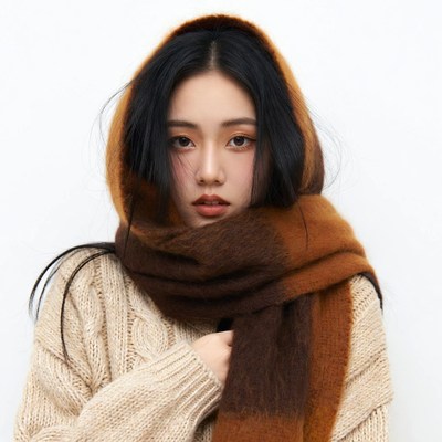 Asian woman in brown scarf
