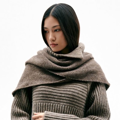 Asian woman in chunky knit scarf