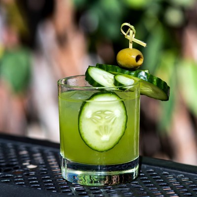 Green Cucumber Cocktail with Olive Garnish